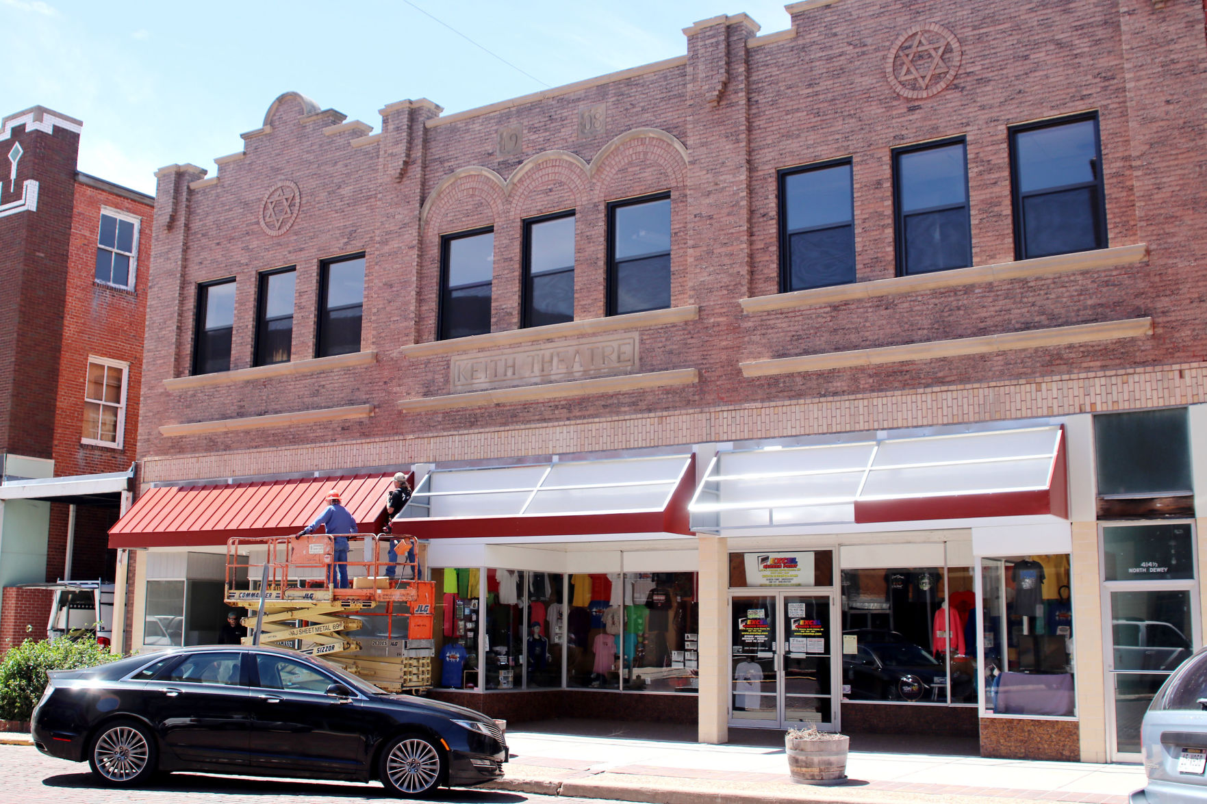 Awnings continue going up, street project moves forward